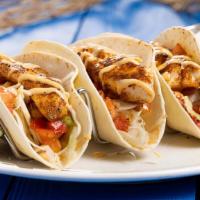 Southwest Fish Tacos · Mesquite seasoned, baked fish wrapped in warm flour tortillas with fresh cabbage, fresh pico...