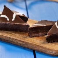 Chocolate Silk Wedges · Wedges of chocolate shortbread topped with chocolate truffle and dark chocolate ganache.