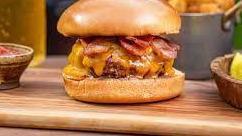 Bacon Cheeseburger · Deluxe includes one patty, American cheese, lettuce, tomato, Mayo and fries.