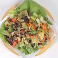 Jerk Chicken Salad · Tender pieces of grilled chicken breast served over lettuce, tomatoes, carrot and onions.