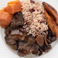 Oxtail · Braised and slowly simmered with herbs and butter beans. Served with rice and peas, white ri...