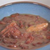 Stew Peas · Fresh red beans, pork tails and beef cooked unil tender and seasoned to perfection with fres...