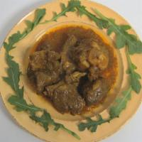 Curry Goat Meal · Braised and simmered in a curry sauce with potatoes and herbs. Served with rice and peas, wh...