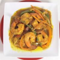 Curry Shrimp Meal · Shrimp simmered in curry sauce with onions and sweet peppers. Served with rice and peas, whi...
