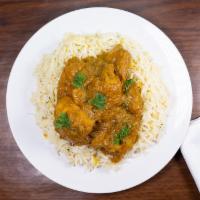 Chicken Curry Old Delhi Style · Chicken on the bone, tomatoes, onions, ginger, and fresh coriander.