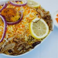 Chicken Biryani · Long grain basmati rice flavored with saffron and cooked with chicken in a delicate blend of...