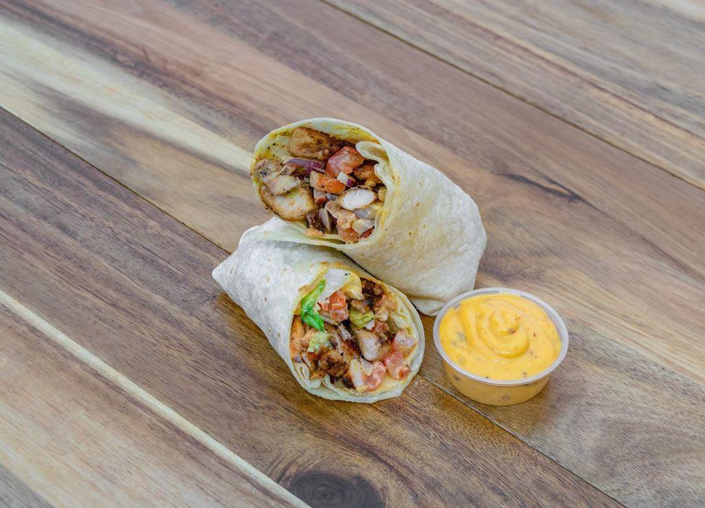 Cajun Chicken Wrap · Marinated chicken breast with Cajun spices in fresh wrap, lettuce tomato red onion and chipotle aioli  on flour wrap
