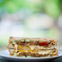 Bbq Chicken Panini · Freshly grilled chicken topped with BBQ sauce, cheddar cheese, Monterey Jack cheese, and sau...