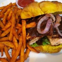 Salmon Burger Combo · Grilled wild caught salmon topped with red onions and special prune sauce on homemade coconu...
