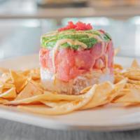 Tuna Tartar · Fresh maguro tuna, flavored with a a combination of spicy, and savory seasonings, laid out o...