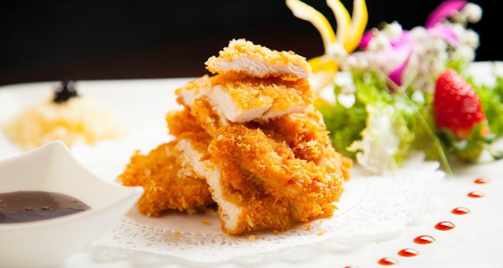 Chicken Katsu Don · Fried breaded chicken cook with mix veg and eggs in house special sauce over the bed of rice.