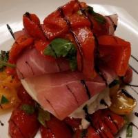 Burrata · Fresh mozzarella stuffed with soft cheese and served over grilled vegetables and prosciutto ...