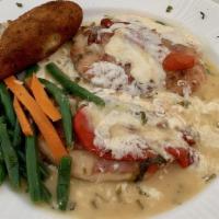 Pollo Scarmoza · Breast of chicken topped with smoked mozzarella, roasted red peppers and prosciutto in a gar...