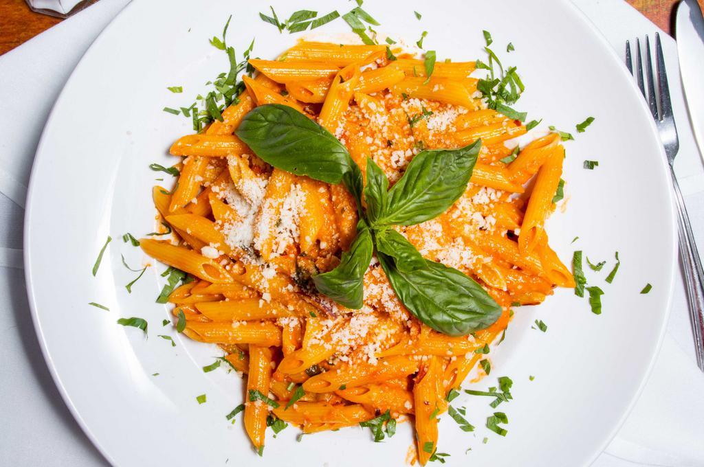 Penne Vodka · Creamy pink vodka sauce topped with parmesan cheese.