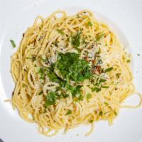 Spaghetti Aglio E Olio · Traditional italian pasta dish with sautéed sliced garlic and olive oil and topped with a li...