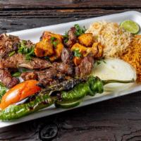 Mix Grill Meal · Kofta, beef kebab, chicken kebab and lamb chops with rice, soup of the day and salad mixed g...