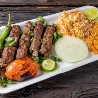 Kofta Meal · Minced beef with vegetables and onions cooked on charcoal grill. Comes with rice, soup of th...