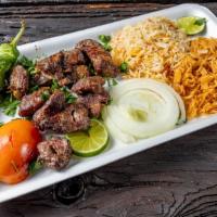 Beef Kebab Meal · Beef kebab with rice, soup of the day and salad mixed greens, tomato, onions with house dres...