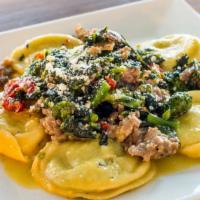 Broc Rabe& Sausage Ravioli · Sundried tomatoes, crumbled sausage and broccoli rabe in a white wine, garlic and oil sauce.