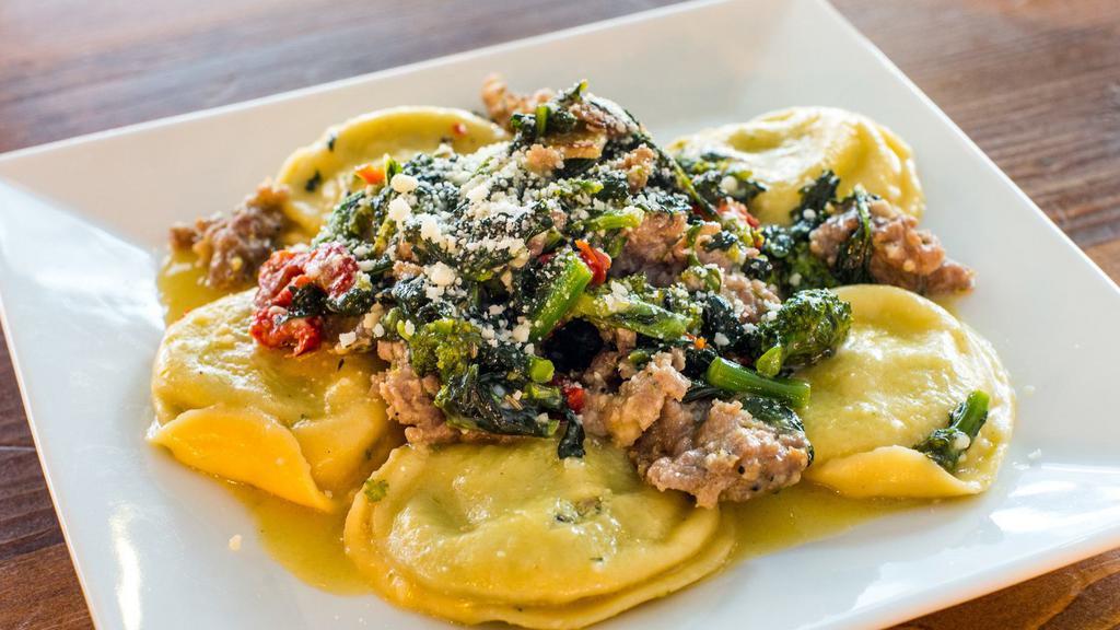 Broc Rabe& Sausage Ravioli · Sundried tomatoes, crumbled sausage and broccoli rabe in a white wine, garlic and oil sauce.