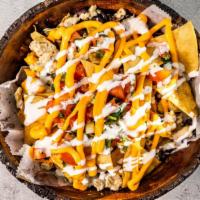 Nachos (One Size) · Fried corn tortilla chips with your choice of meat. Toppings include beans, pico de gallo, n...