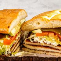 Tortas · Telera bread with beans, the meat of your choice, lettuce, onions, tomatoes, Oaxaca cheese, ...