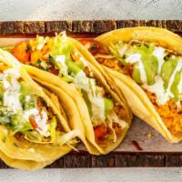 Veggie Tacos · Three doubled corn tortillas with cheese (optional), Mexican rice, lettuce, pico de gallo, g...