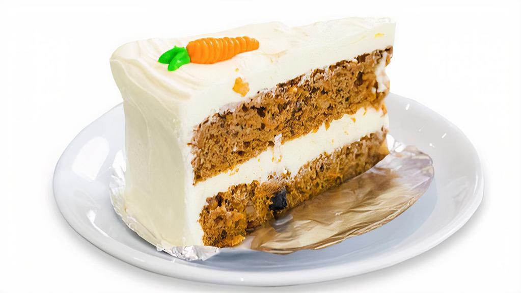Carrot Cake · Rich carrot cake with creamy butter.