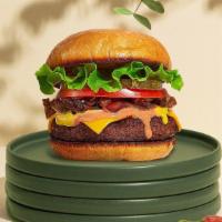 Classic Ritual Burger · Seasoned Beyond Meat patty perfectly cooked to medium on a griddled bun. Served with crispy ...