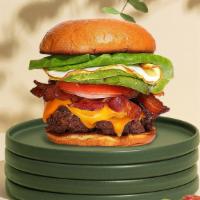 A Bite Of Dawn Burger · Seasoned Beyond Meat patty perfectly cooked to medium, topped with vegan bacon, scrambled ve...