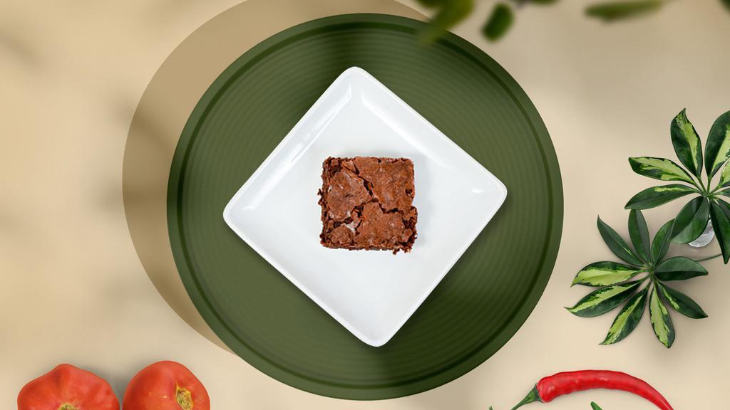 Twilight Chocolate Zone · Chocolate batter baked to perfection, chocolate chips, and chocolate sauce make this the triple-chocolate vegan brownie of your dreams.