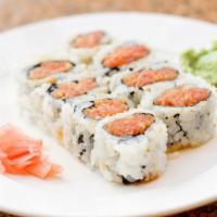 Spicy Tuna Roll · Spicy tuna and seaweed wrapped in rice.