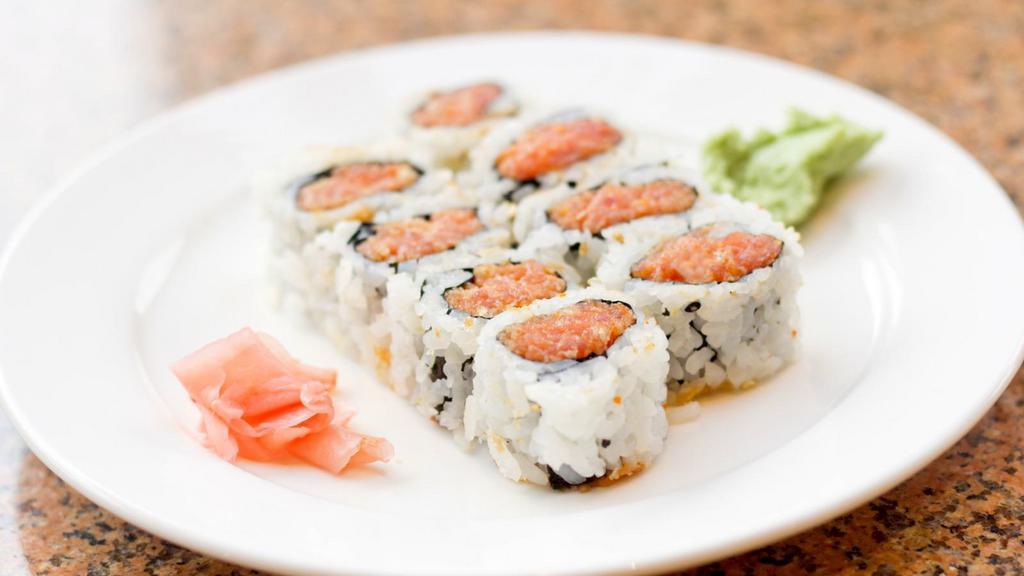 Spicy Tuna Roll · Spicy tuna and seaweed wrapped in rice.