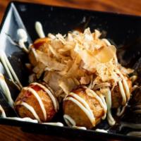 Takoyaki (6 Pc) · Octopus, bonito flakes (dried fish) with mayo and donkatsu sauce.