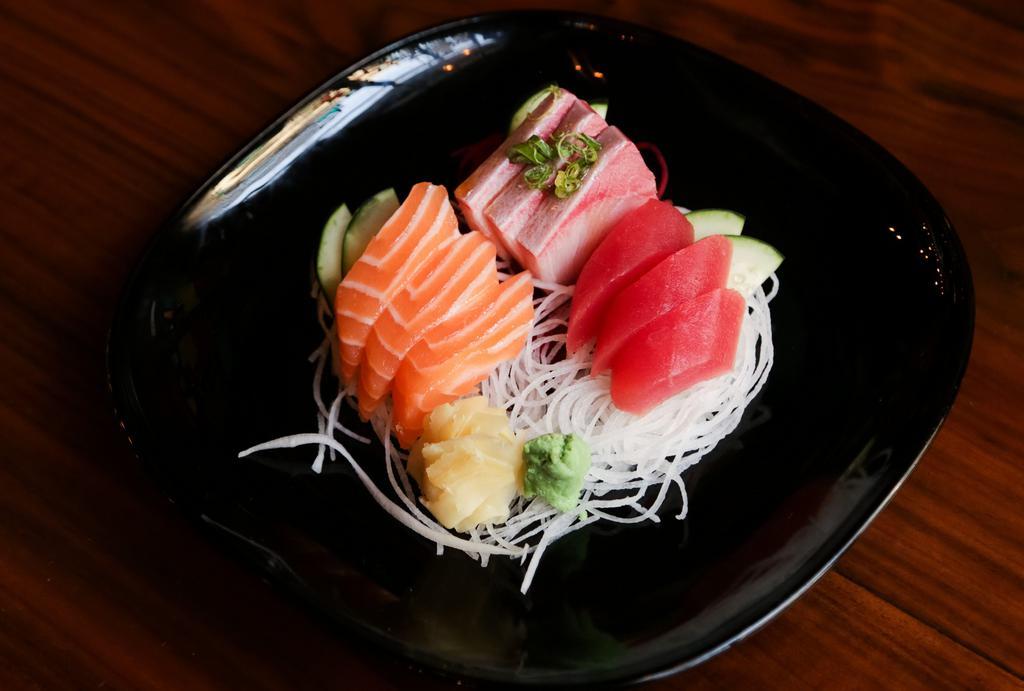 Sashimi (9 Pc) · Tuna, salmon, yellowtail.
