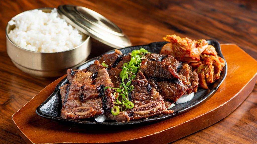 Beef Galbi · Grilled marinated short rib and kimchi with rice.