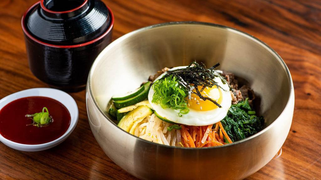 Bibimbap · Spinach, carrot, shiitake mushroom, green squash, bean sprout, scallion, sesame seeds, and oil, sunny side egg.