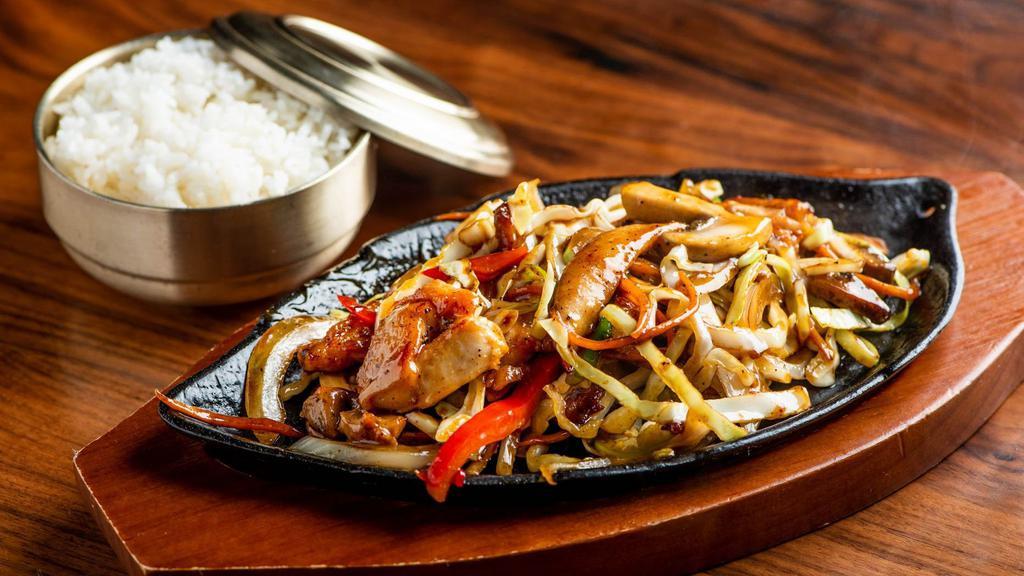 Teriyaki · Cabbage, onion, peppers, carrot, mushroom, scallion with teriyaki sauce on sizzling pan served with rice.