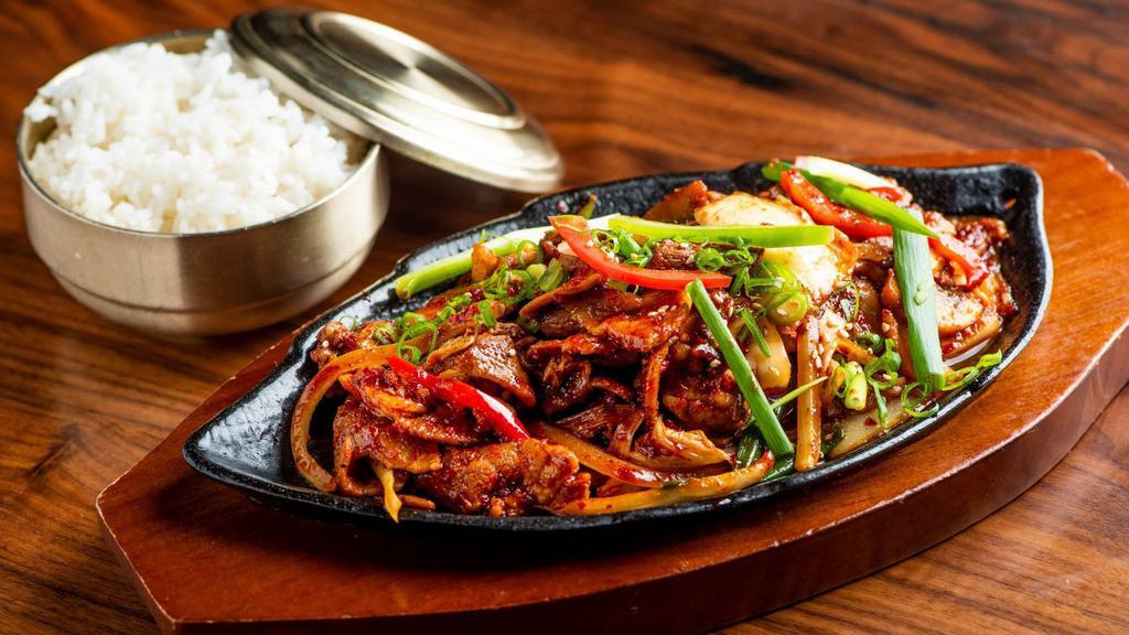 Jeyuk Kimchi Bokum · Hot. Spicy pork with kimchi, onion, peppers, scallion, and mushroom on sizzling pan served with rice.