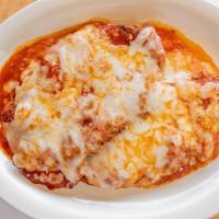 Baked Lasagna · Made with fresh ricotta, and a meat sauce topped with melted mozzarella cheese.
