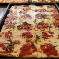 Grandma (Square Focaccia) · Thin crust with fresh mozzarella topped with a red sauce loaded with garlic, and fresh basil.