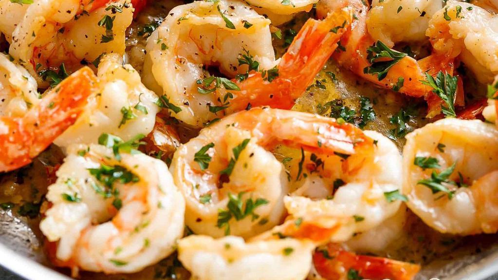 Shrimp Scampi · Fresh jumbo shrimp in light butter, garlic, and white wine sauce.