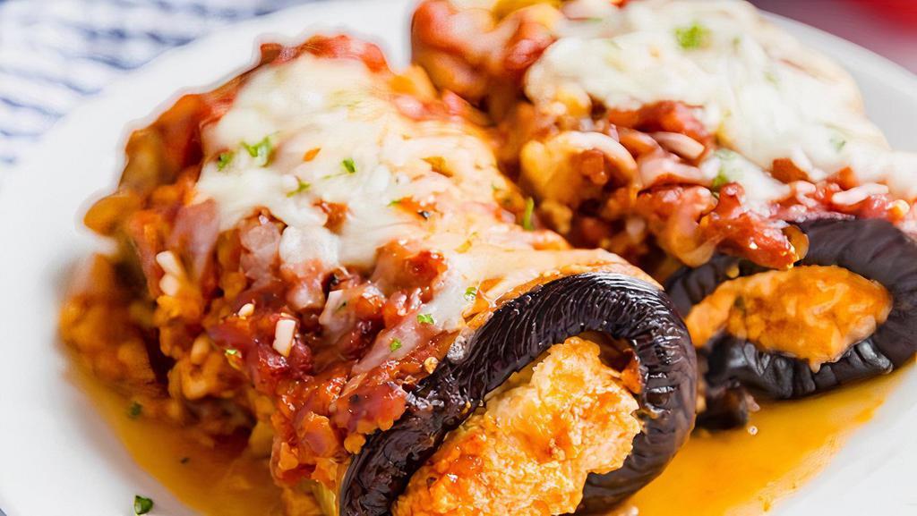 Eggplant Rollatini · Eggplant rolled with seasoned ricotta topped with tomato sauce and melted mozzarella.
