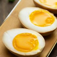 1/2 Marinated Egg / 溏心蛋 · Soft boiled eggs with custard like egg yolk soaked in soy sauce and mirin.