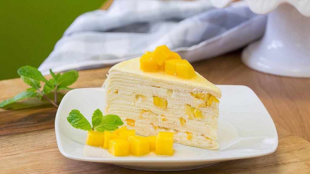 Mango Crepe Cake / 芒果千层糕 · Mille Crepe with stuffed and topped with fresh mango.