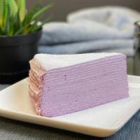 Purple Sweet Potato Crepe Cake / 紫薯千层蛋糕 · Purple Sweet Potato Flavored Mille Crepe Cake topped with sugar powder.