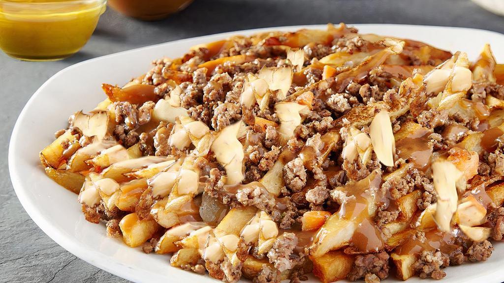 Classic Canadian Poutine · Rice brown gravy and Hearty cheese curds.