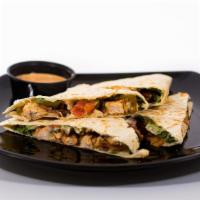 Chipotle Chicken Quesadilla · Grilled chicken, chipotle ranch, bacon, shredded lettuce, tomato, and cheddar jack cheese. S...