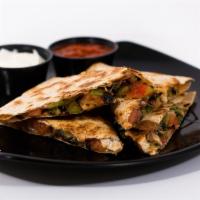 Garden Quesadilla · Sauteed peppers and onions, tomatoes, melted cheddar and jack folded and grilled in a flour ...