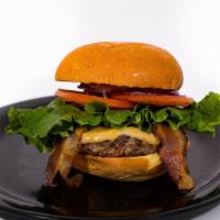 Bacon Cheddar Burger · Crispy bacon, cheddar jack cheese served on a brioche bun. Cooked medium well.